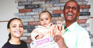 Serkalem Fasi and Eskinder Nega with their son