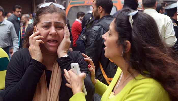 Women try to reach loved ones after the attack in Alexandria.