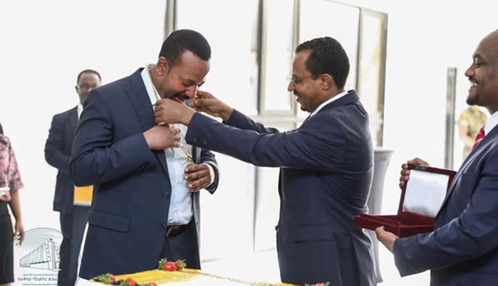 Lemma Megerssa honouring Abiy Ahmed