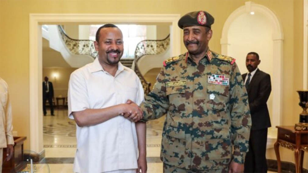 PM Abiy Ahmed (L) and Abdel Fattah Al-burhan (R)