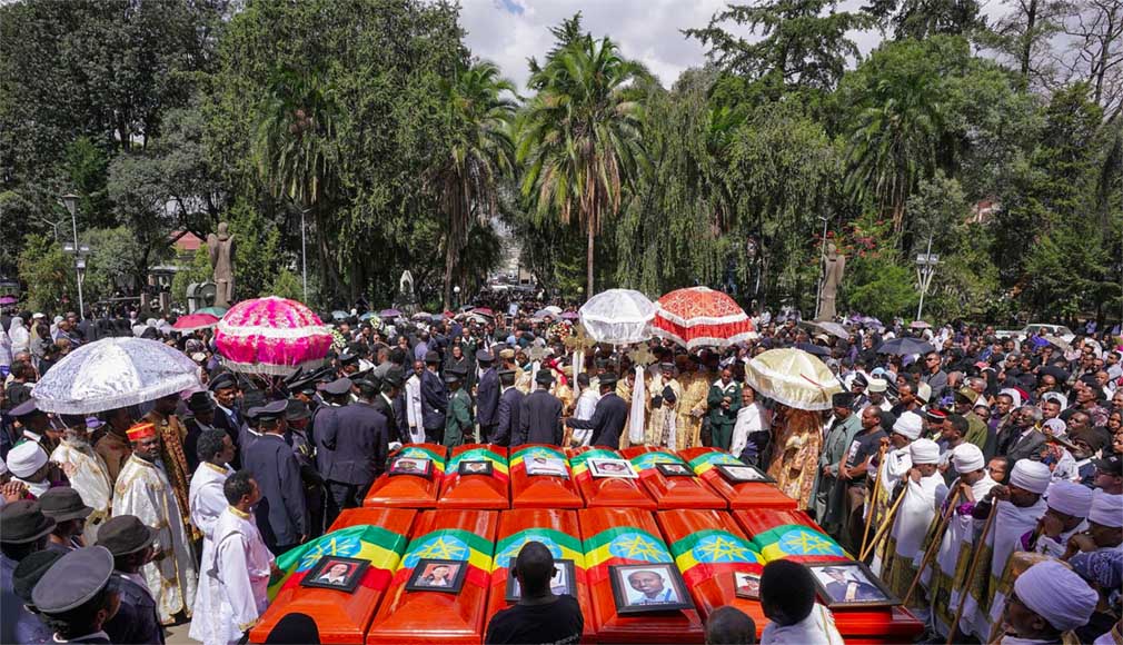 Twelve coffins are pictured outside a church in Addis Ababa after the Ethiopian Airlines crash