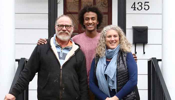 Merhawi Stephen with his parents.