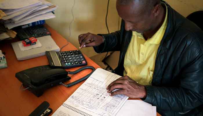 Luel Abera, reception coordinator at the Adinbried entry point, keeping track of the number of Eritrean arrivals. Luel Abera keeps track of new arrivals
