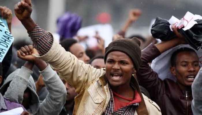 Protesters chant slogans during a demonstration over what they say is unfair distribution of wealth in the country at Meskel Square in Ethiopia