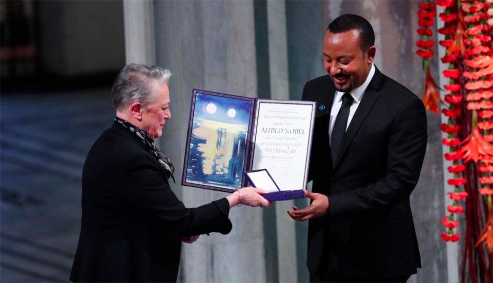 Ethiopia's Prime Minister Abiy Ahmed is presented by the Chair of the Nobel Committee Berit Reiss-Andersen, left, during the Nobel Peace Prize award ceremony in Oslo City Hall, Norway, Tuesday Dec. 10, 2019.